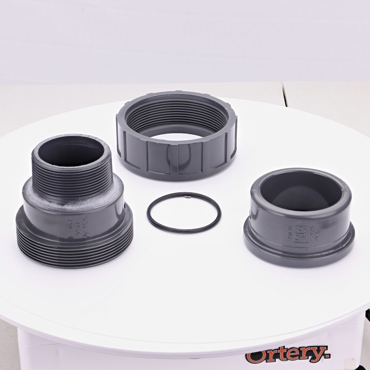 The NDS 2 in. Slip X MPT PVC Union shown here unassembled, includes the EPDM O-ring that is placed in the center of the union to create a leak-resistant seal (NDS U-2000-SM)