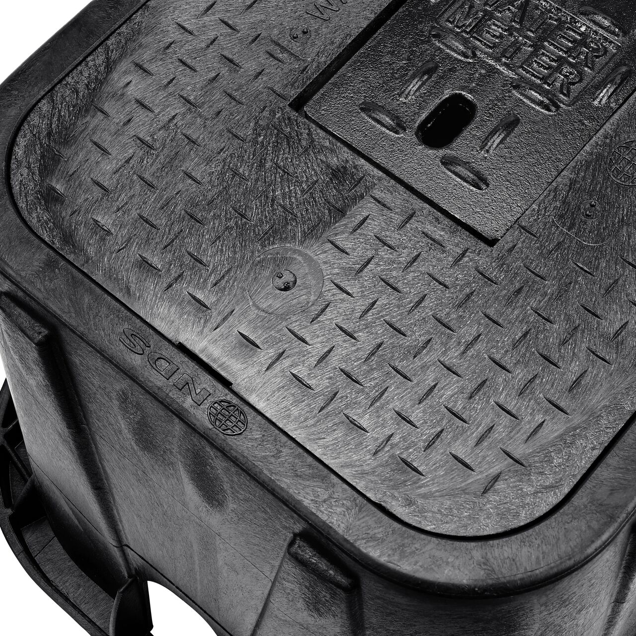The drop-in meter box lid securely in place on the NDS 14 in. X 19 in. Rectangular Standard Series Black Meter Box and Black Water Meter Cover with Cast Iron reader door (NDS D1200-DICIR) keeping components protected against the elements, foot traffic, lawn care equipment, and potential vandalism while keeping them out of sight