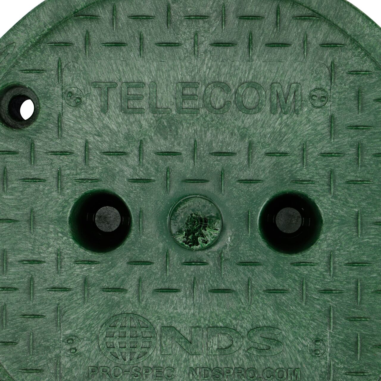 Closeup view of the Telecom markings on the green telecom cover for the NDS 10 in. Round Pro-Spec Series Valve Box & Telecom Cover (NDS 311BCBT)
