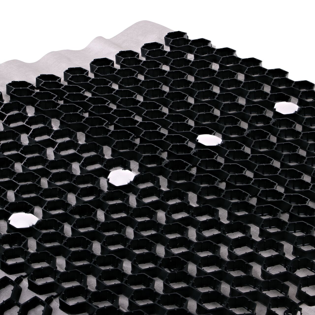 Use multiple White NDS EZ Marker™ Parking Delineators (NDS EZMARKER) in the Black NDS EZ Roll® Gravel Pavers (NDS GP4X150) to guide motorists