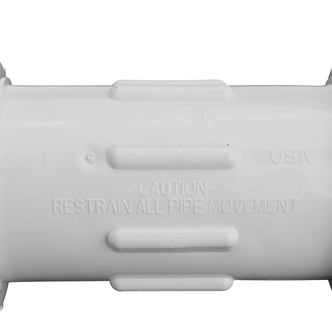 Closeup view of the NDS 1 in. IPS UC Compression Coupling showing that it is made in the USA as part of a complete flow management system for pool, spa, irrigation, and plumbing applications (NDS CCC-0500)