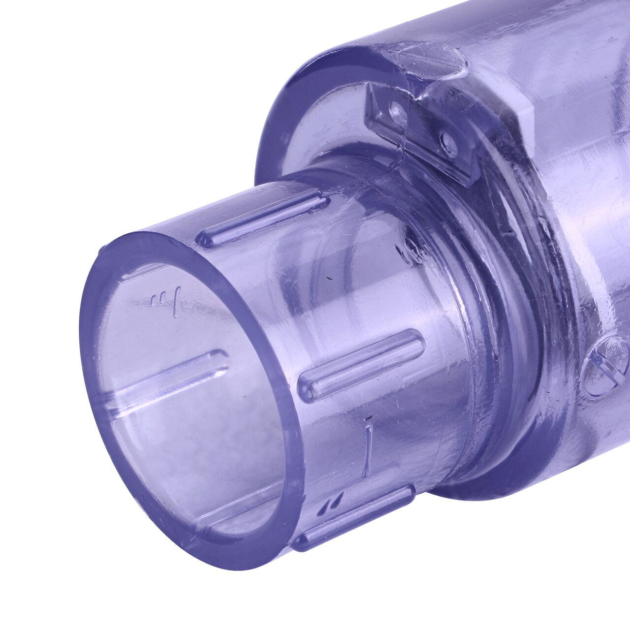 Closeup of the outlet end of the NDS Clear 1 in. slip end by slip end PVC Swing Check Valve (NDS 1520C10) which prevents backflow in pipelines