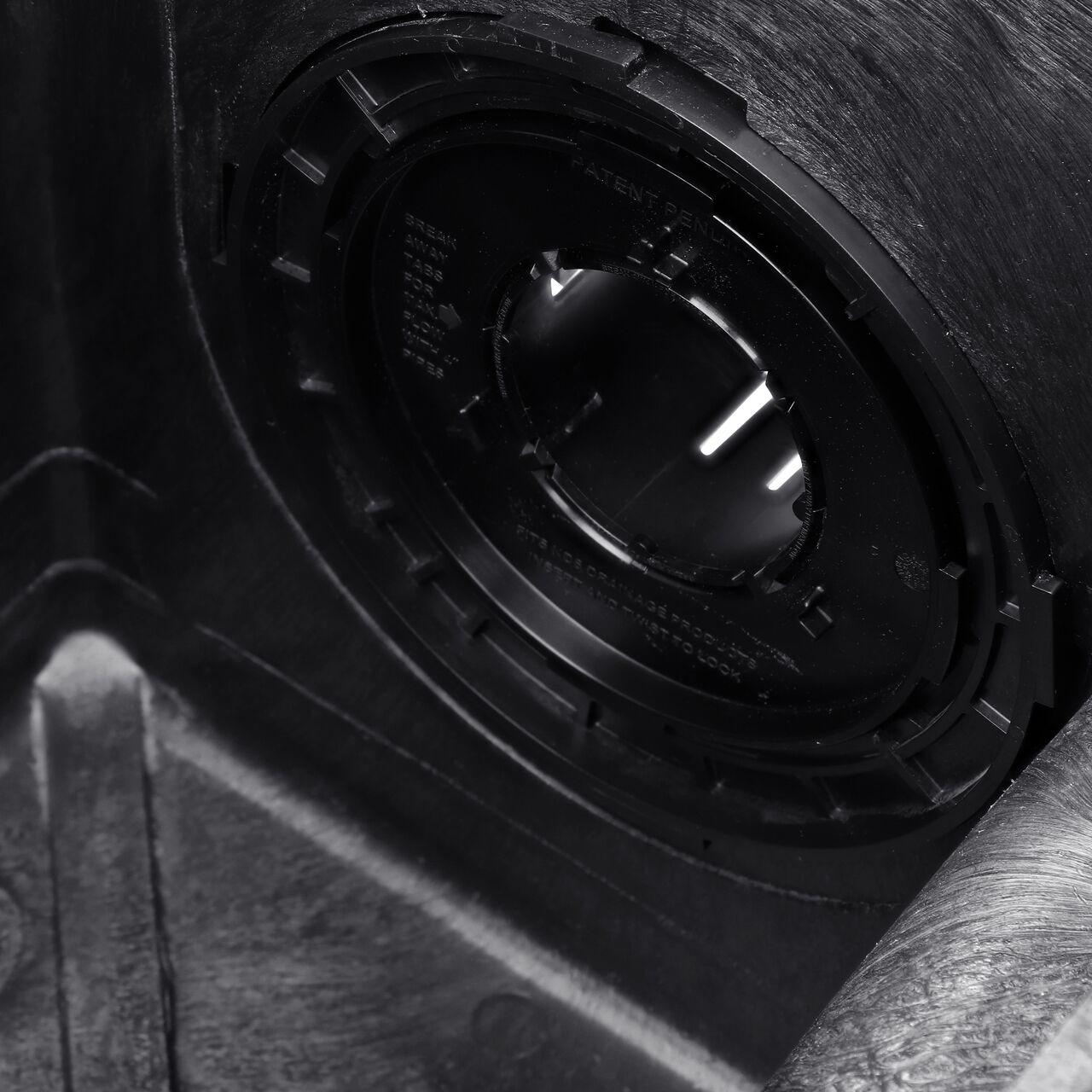 Closeup of the  NDS Locking Outlet Adapter (NDS 1243) attached to a 12 in. catch basin looking at the locking mechanism