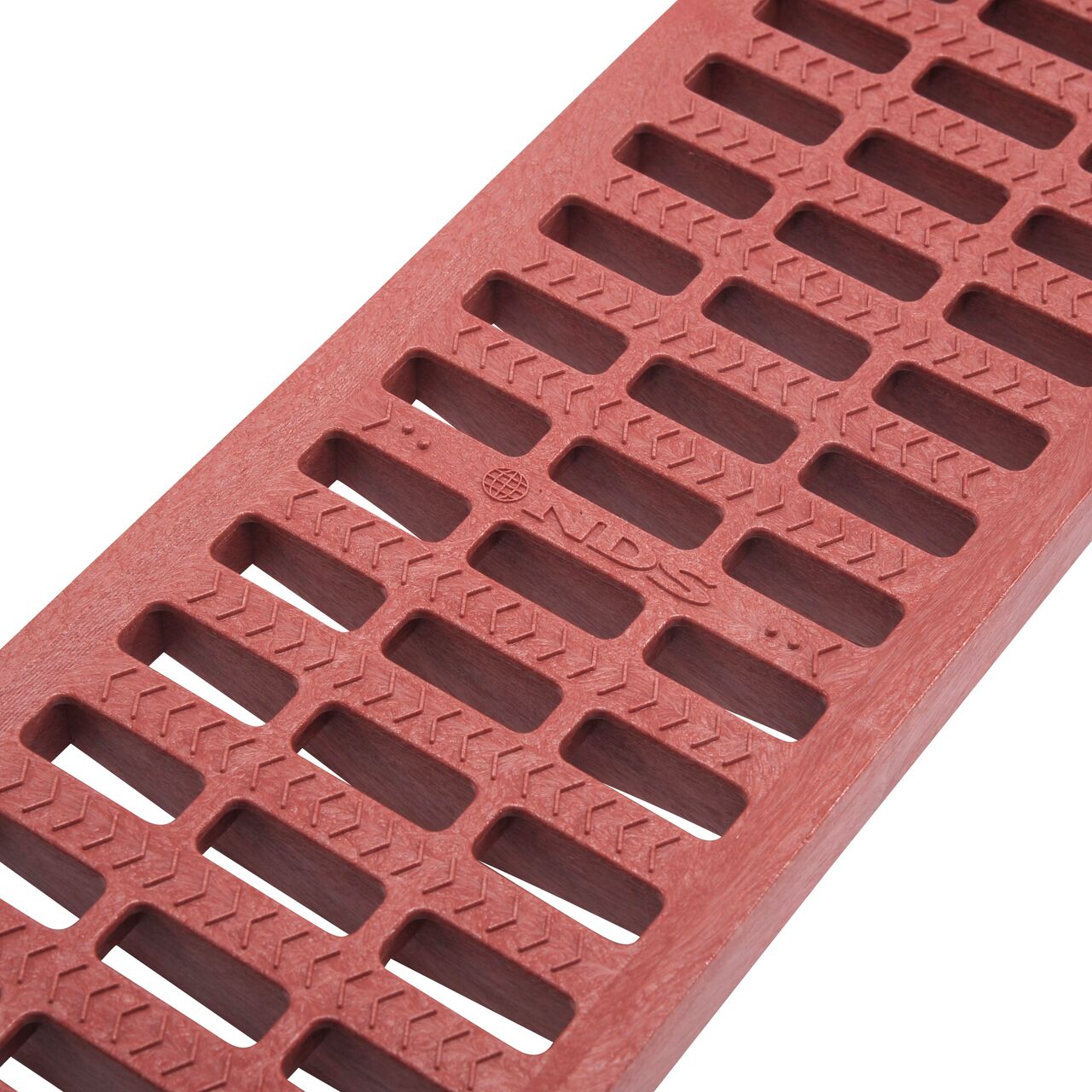 Closeup of grate openings on NDS 5 in. Pro Series Channel Drain Grate in Brick Red Plastic (NDS 818)