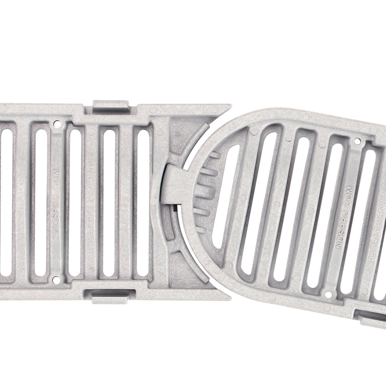 Closeup view of the underside of the grate showing the pivot joint curved to the left position 9 degrees on the NDS Spee-D® Contour™ Channel Drain Start & End Kit (NDS 400-ACSE-WH) that connects the Contour pieces without the need for a coupling