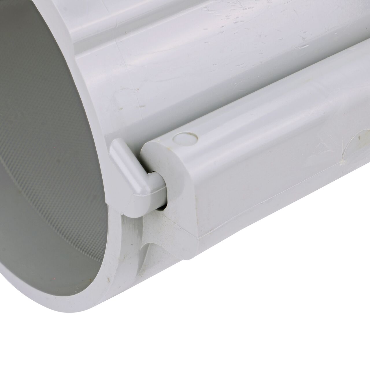 Closeup view of the hinge on the 4 in. NDS Flo-Tap™ Rigid PVC saddle with 3/4 in. socket or 1 in. spigot in the closed position  (NDS 3140)