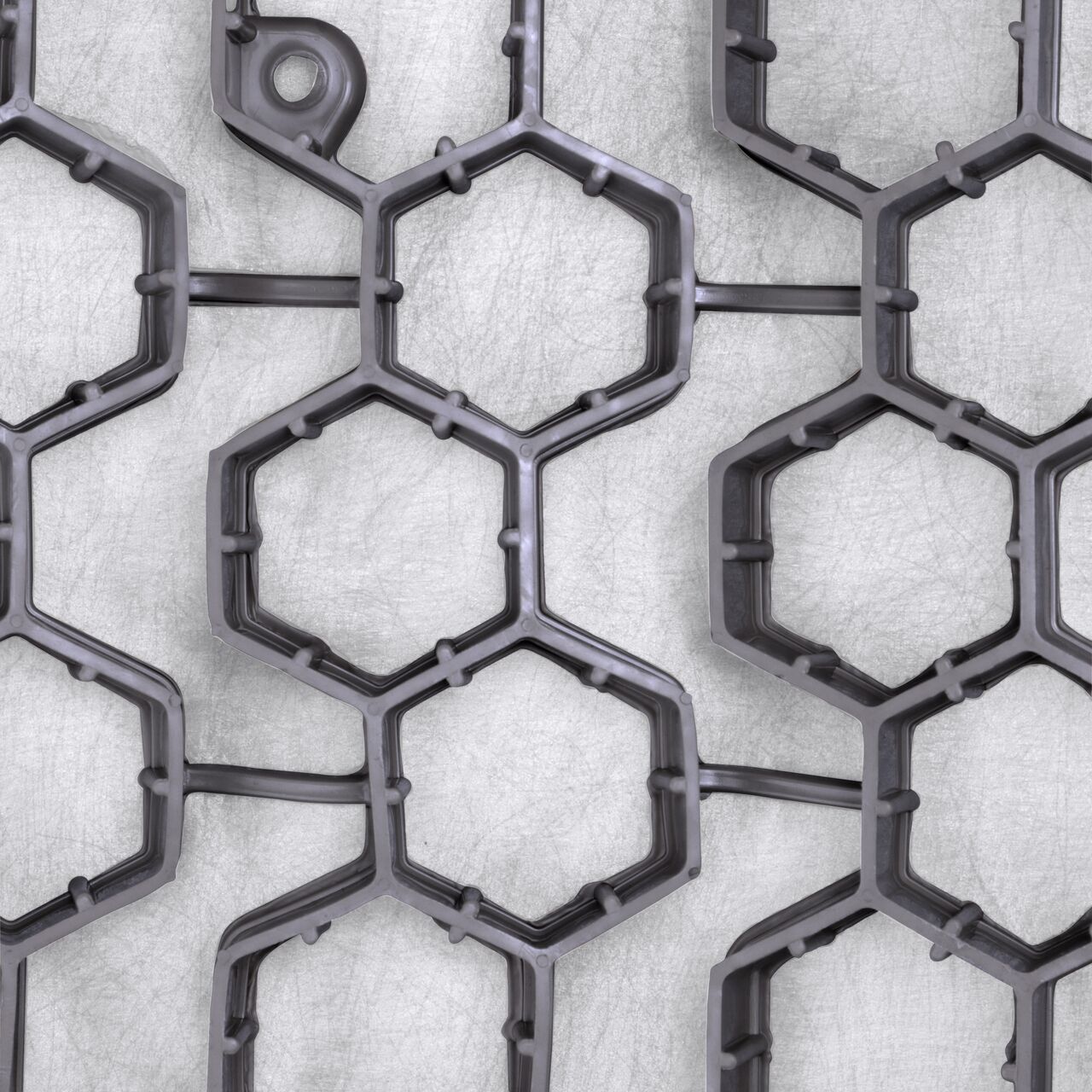 Top Down View of the gray interconnected hexagonal cells with shared walls which provide strength in the Gray NDS EZ Roll® Gravel Pavers (NDS GP4X150G)