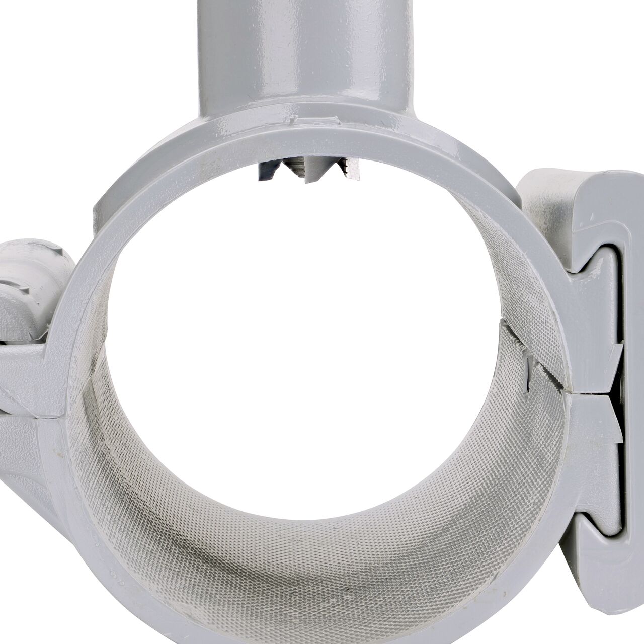 Closeup view of the built-in saw tooth cutter in position as if cutting pipe on the 3 in. NDS Flo-Tap™ Rigid PVC saddle (NDS 3130) which cuts easily through PVC pipe wall and captures debris before it can enter the water supply