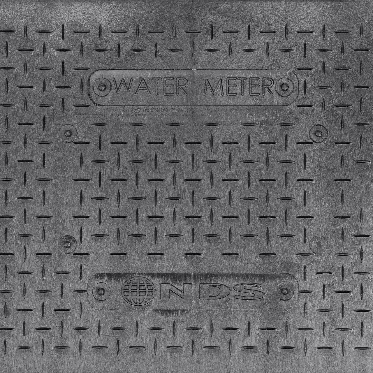 Closeup view of the Water Meter markings on the Black Water Meter Drop-in cover for the NDS 14 in. X 19 in. Rectangular Standard Series Meter Cover (NDS D1200-DISBL)