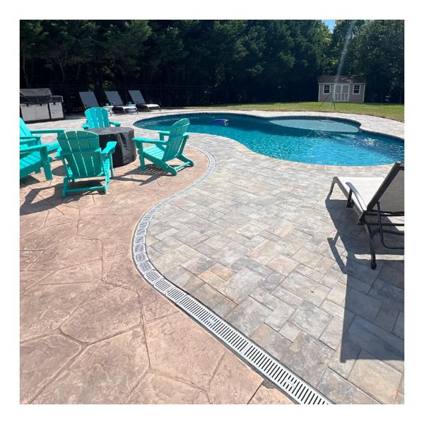 Lifestyle view of the new NDS Spee-D® Contour™ Channel Drain System (NDS 400-ACSE-WH, NDS 400-ACM-WH) which make natural curves in your channel drain system that are quick and easy to install along irregular or curved hardscapes
