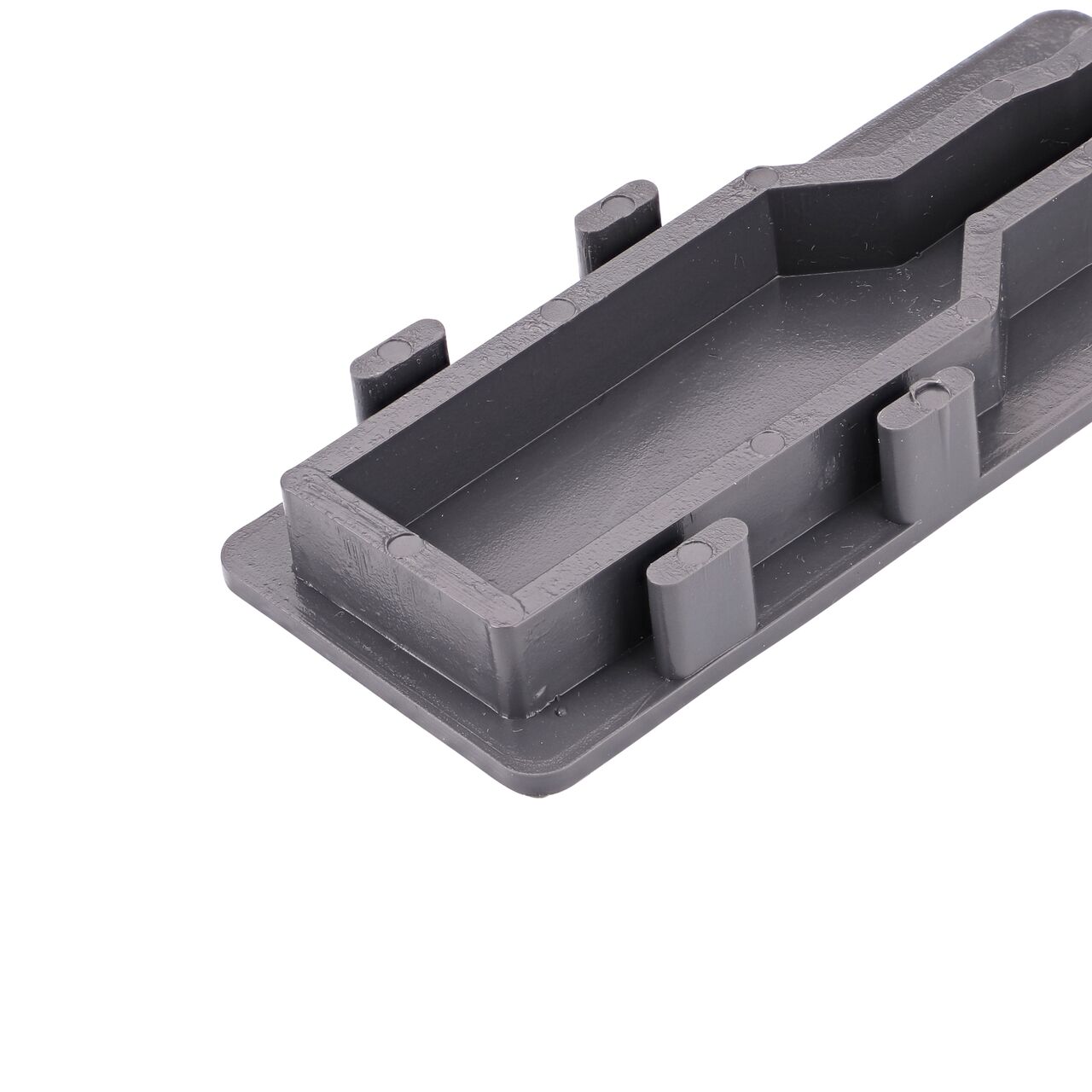 Closeup of the tabs in the back of the NDS Gray Micro Channel™ Drain End Plug (NDS 8473)