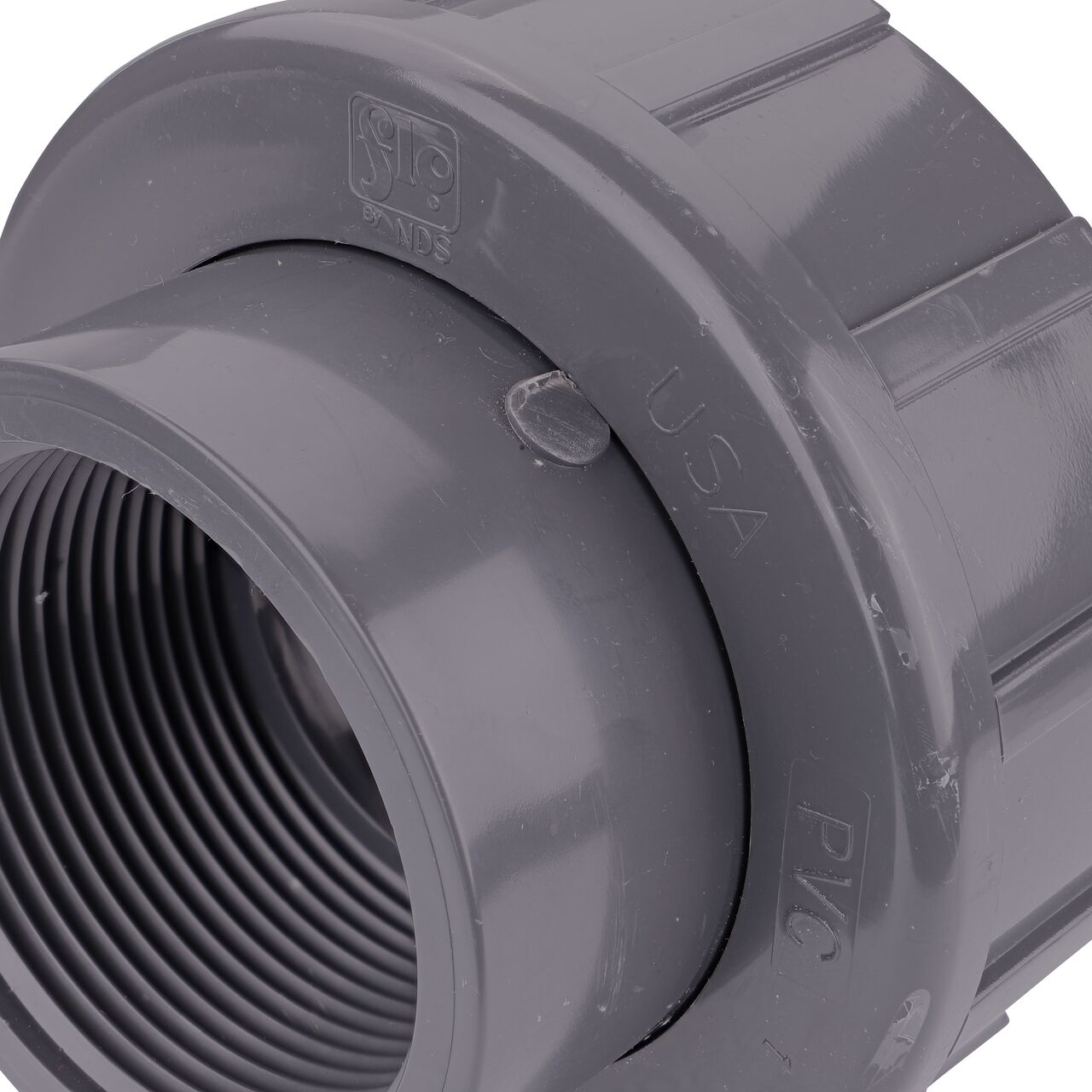 Close up view of the NDS 2-1/2 in. PVC FPT Union showing NDS brand a leader in flow management solutions and the preferred choice of professionals since 1972 mark (NDS U-2500-T)
