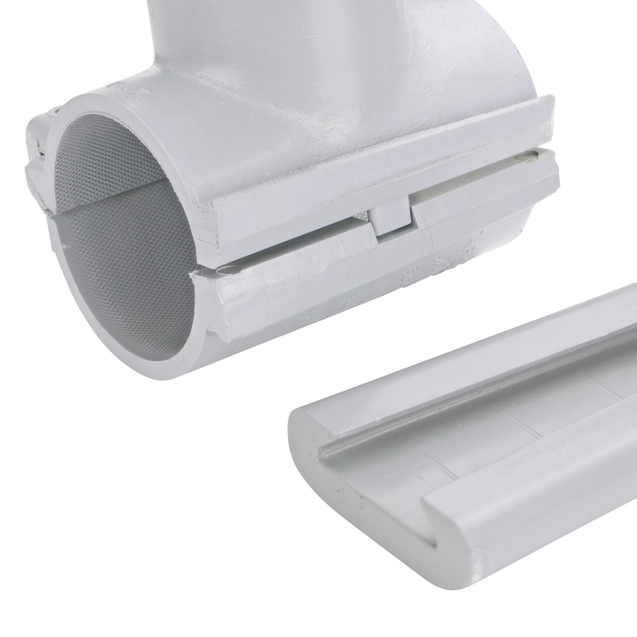 Closeup view of the patented wedge which unconnects on the 2 in. NDS Flo-Tap™ Rigid PVC saddle with 1-1/2 in. socket or 2 in. spigot for easy installation (NDS 3220)