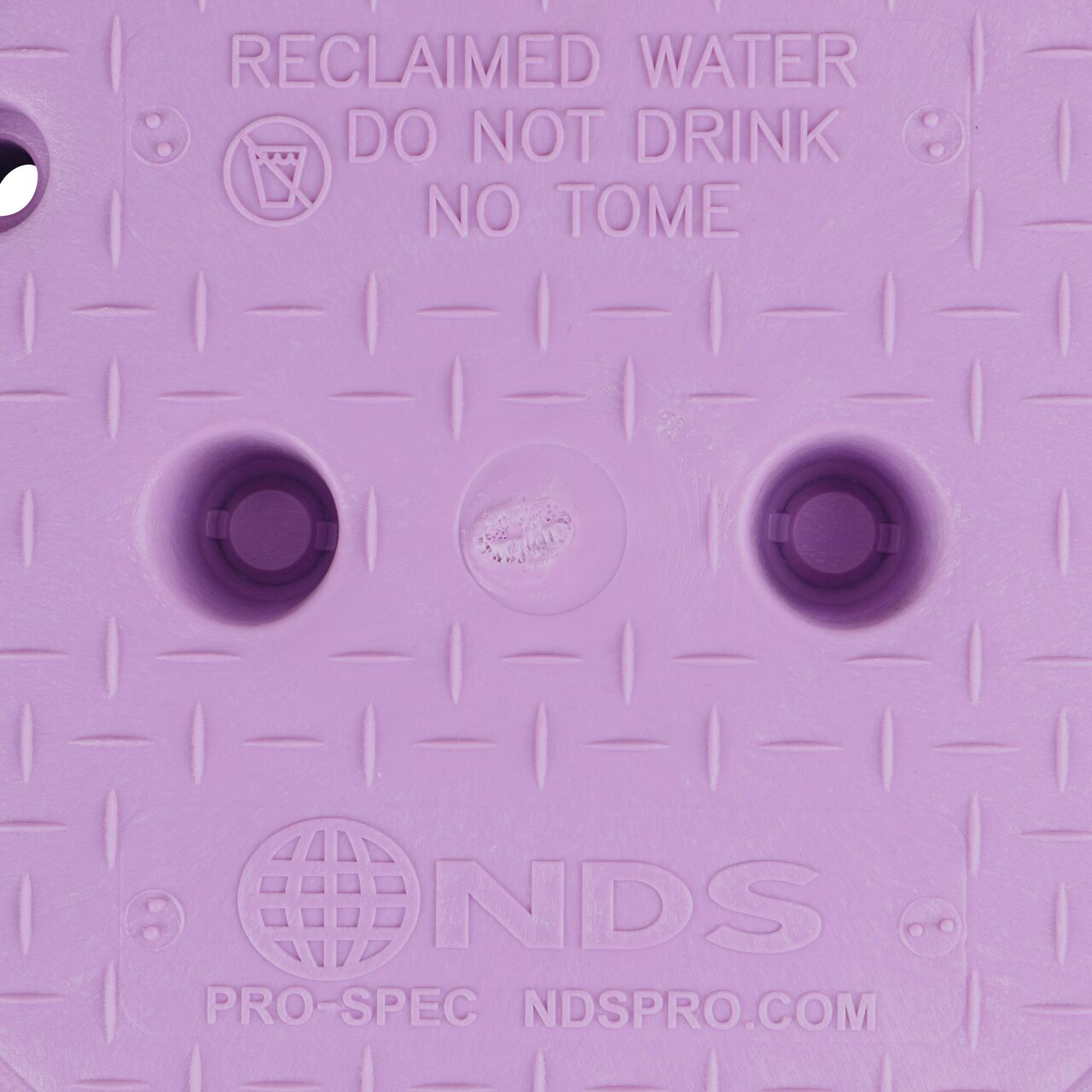Closeup view of the Water markings on the Purple Reclaimed Water cover for the NDS 10 in. Round Pro-Spec® Series Valve Box (NDS 312PBCBR)