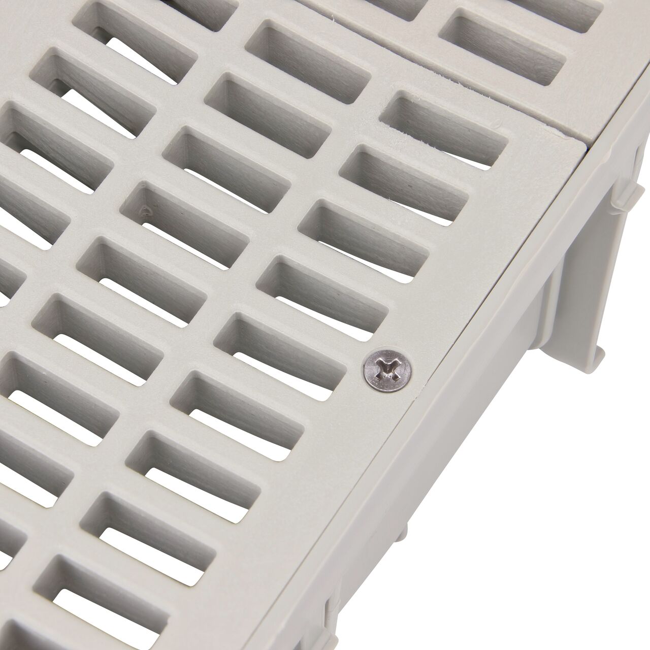 Closeup of #8 X 1 in. Phillips Flat Head Screw securing gray grate to 3 in. Pro Series Channel (NDS 229)