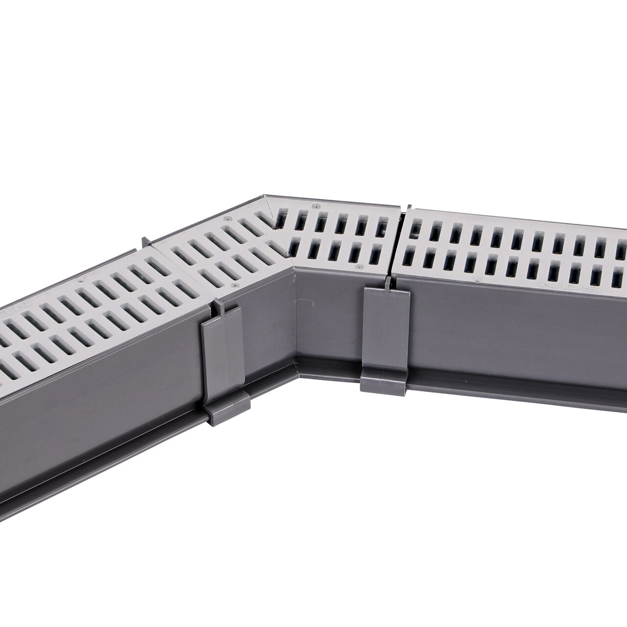 Fully installed NDS Gray Mini Channel™ Drain 45 Degree Elbow and Grate (NDS 5300) with couplers and channel drains with grates