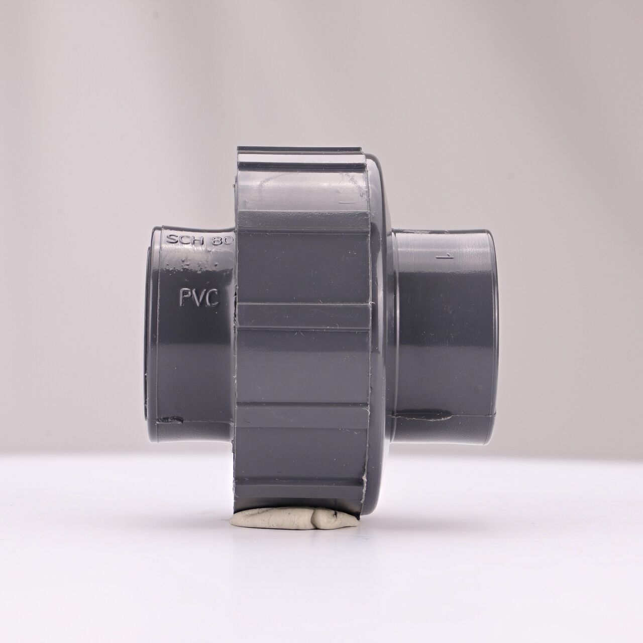 Side view of the NDS 3/4 in. PVC Union (NDS U-0750-T) shows both threaded ends and a pull-apart feature to quickly disconnect from pipes