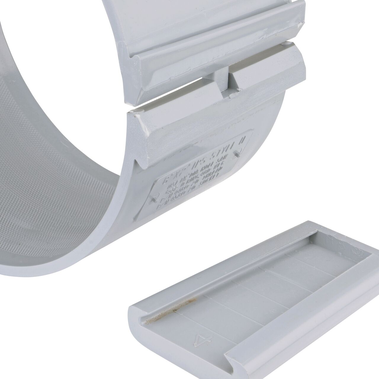 Closeup of the wedge latch uninstalled on the NDS Clamp-It™ Rigid PVC Saddle with 2 in. FPT connection on top (NDS 448020) for 8 in. PVC pipe