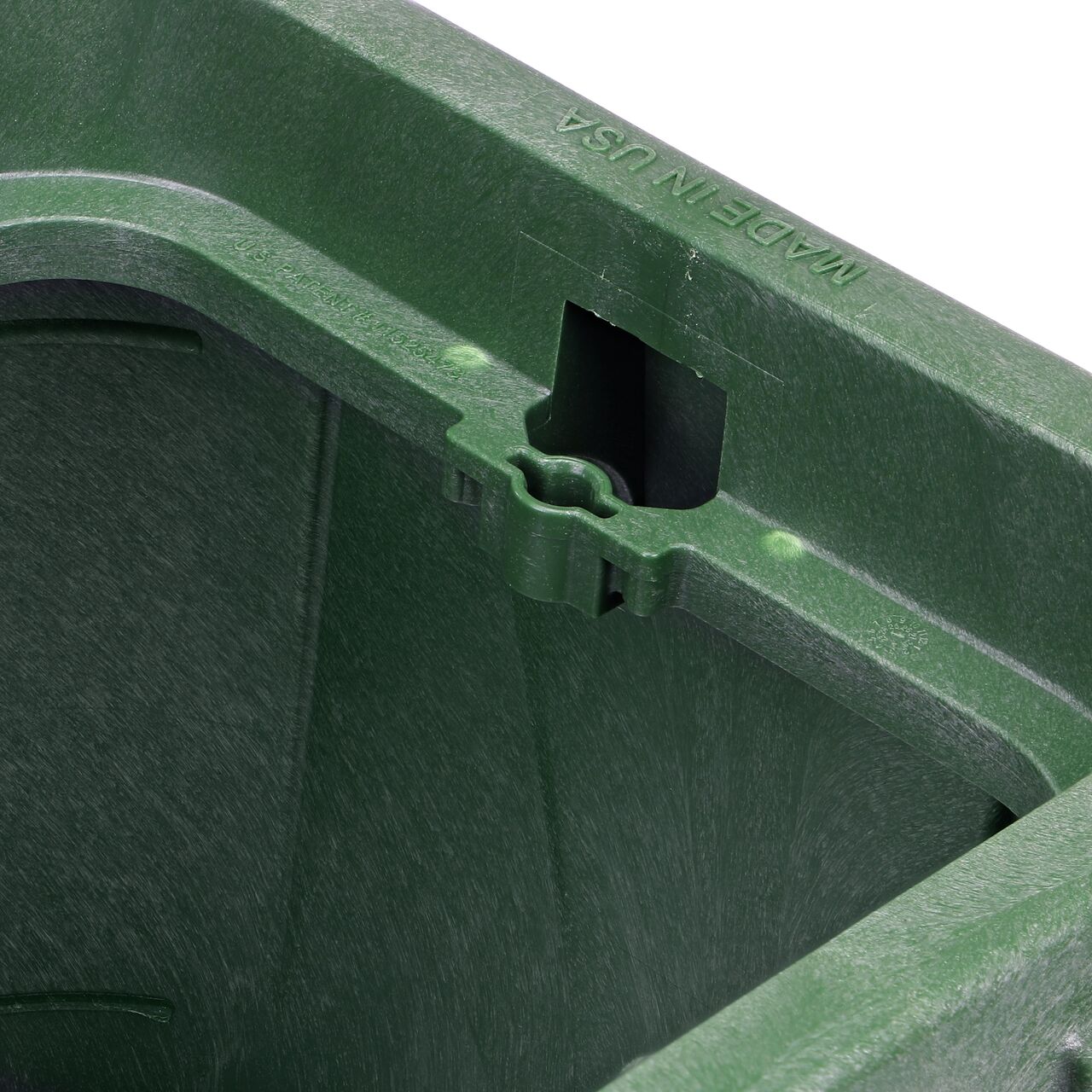 Closeup view of the universal locking mechanism hole on the Green NDS 14 in. X 19 in. Rectangular Pro-Spec® Series Valve Box (NDS 314BCBS) for securing valve lid or cover to the valve box