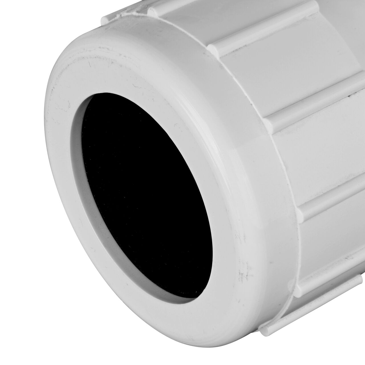 Closeup view of the NDS PVC Threaded Tees showing the compression end with 1-1/4 in. adjustable nuts that secured in place which reduces pull-out from pipe (NDS CPT-1250-T)