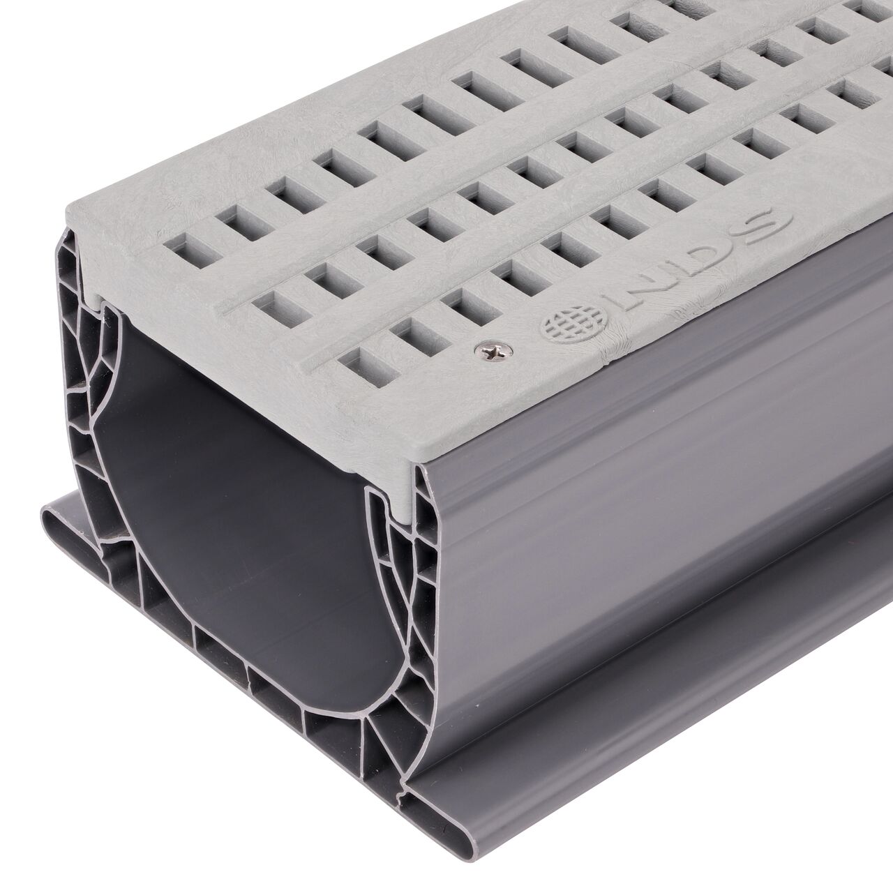 Closeup edge of the Gray NDS Decorative Wave Spee-D® Channel Drain Grate (NDS 253GYRTL, NDS 253GY) installed on a Spee-D Channel Drain (NDS 400)