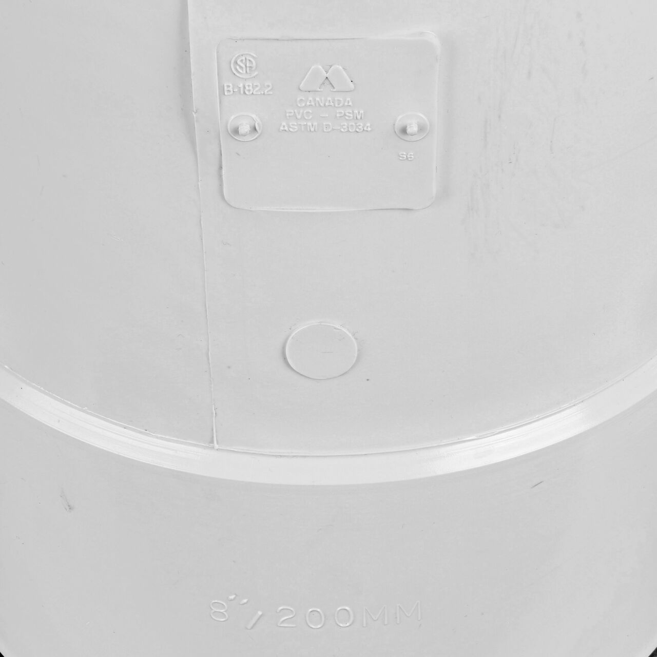 Closeup of any wording on the PVC tee for Sewer and Drain pipes; 8 in. Hub X Hub X 4 in. Hub connection (NDS 84P01)