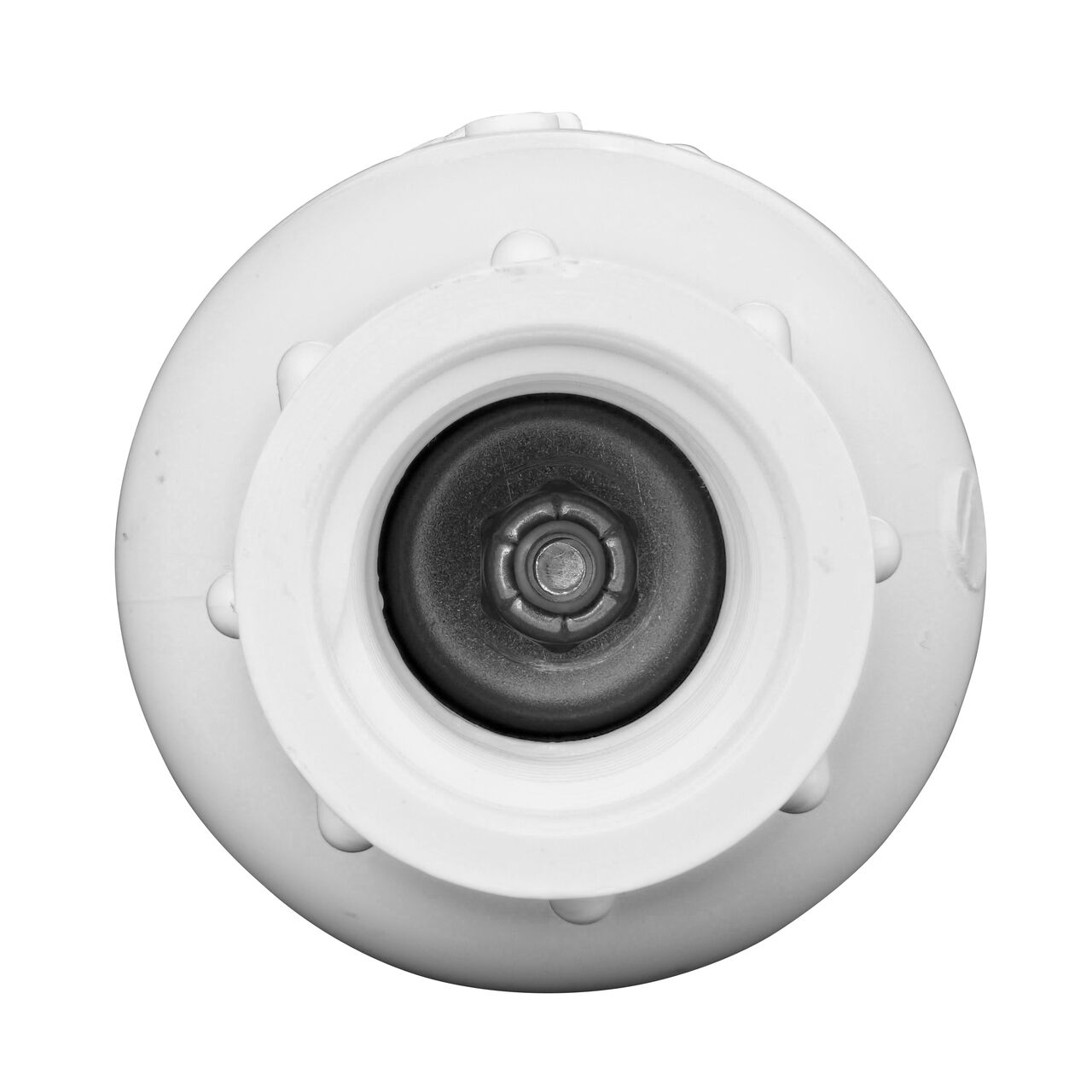 Closeup of the adjustable nut on the NDS White 1/2 in. IPS FPT X FPT PVC Adjustable Spring Check Valve with 2-5 lb. Spring (NDS 1205-05)