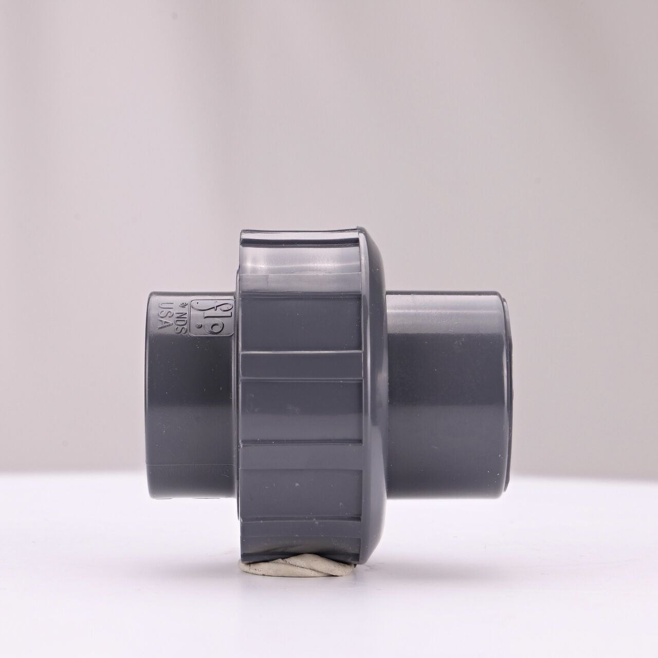 Side view of the NDS 3/4 in. PVC Union (NDS U-0750-S) shows both slip ends and a pull-apart feature to quickly disconnect from pipes