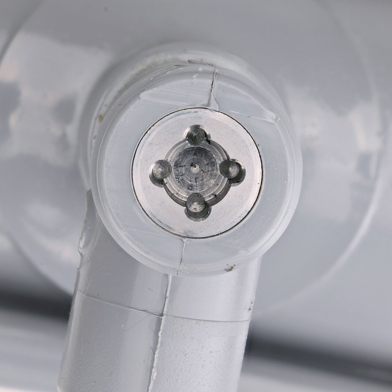Closeup view of the built-in saw tooth cutter in the top connection of the 3 in. NDS Flo-Tap™ Rigid PVC saddle with 3/4 in. socket or 1 in. spigot which cuts easily through PVC pipe wall and captures debris before it can enter the water supply (NDS 3130)