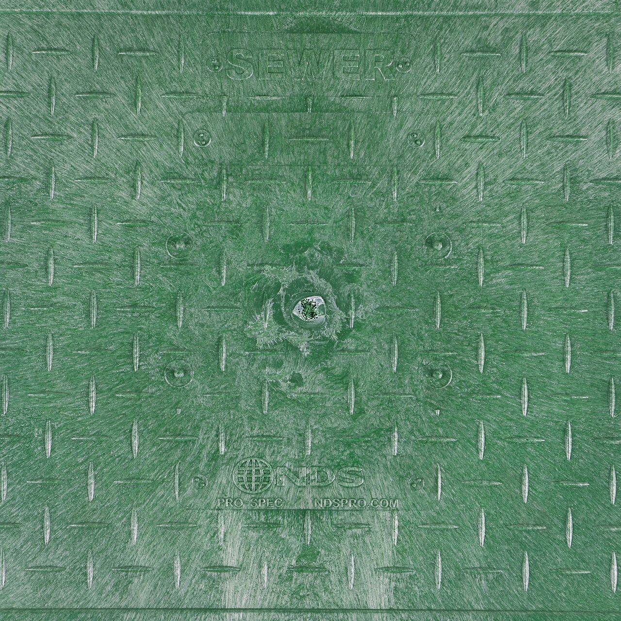 Closeup view of the Sewer markings on the Green Sewer cover (NDS 322CS) for the NDS 13 in. X 24 in. Rectangular Pro-Spec® Series Valve Box