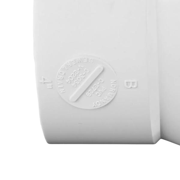 Closeup of the wording on the outside of the  4 in. PVC Double Cleanout which has three S&D Hub connection points (NDS 417P)