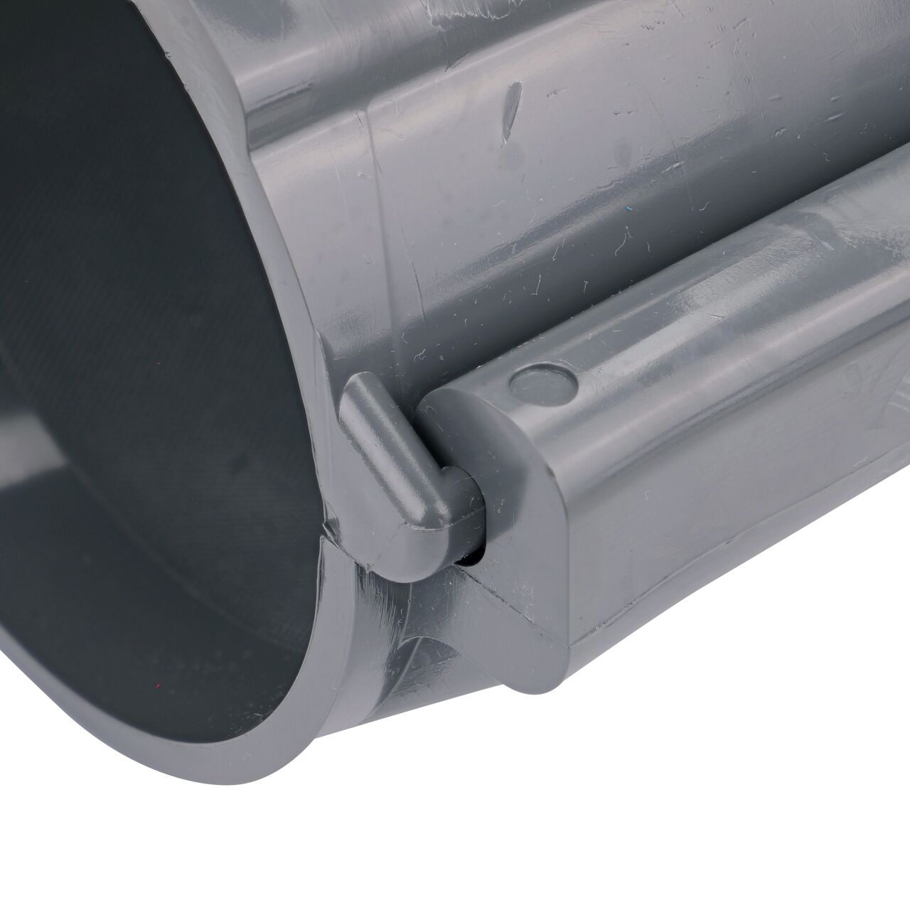 Closeup of the hinge closed on the NDS Clamp-It™ Rigid PVC Saddle with 1-1/2 in. slip connection on top (NDS 454015) for 4 in. PVC pipe