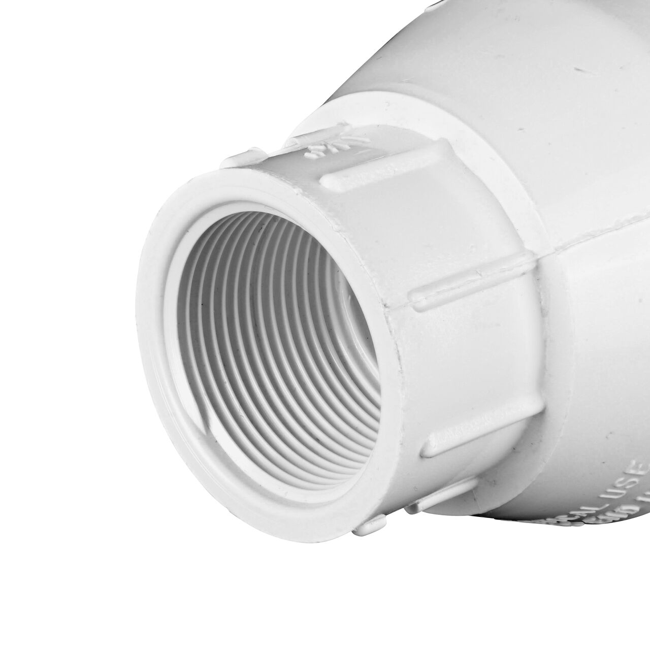Closeup of the outlet end of the NDS White 1-1/4 in. female end by female end PVC Swing Check Valve (NDS 1520-12F) which prevents backflow in pipelines