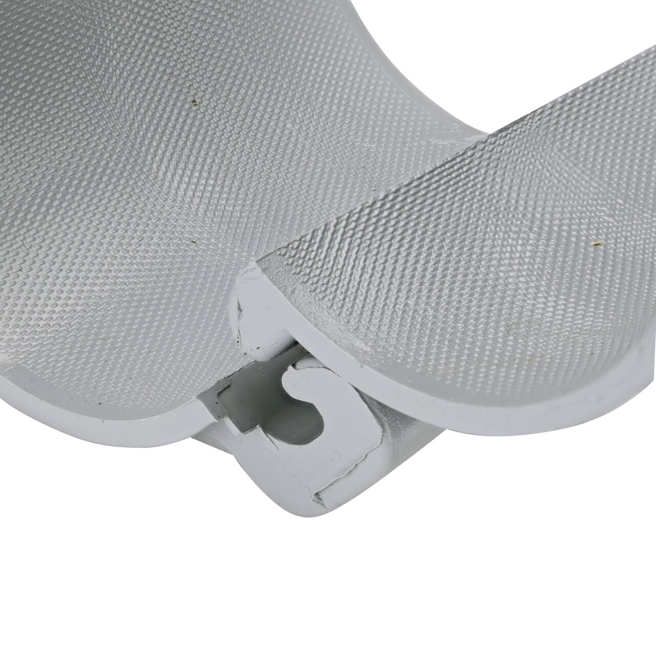 Closeup view of the hinge on the 3 in. NDS Flo-Tap™ Rigid PVC saddle with 3/4 in. socket or 1 in. spigot connection on top (NDS 3130) in the opened position that allows for easy installation onto Schedule 40 or Schedule 80 PVC pipe
