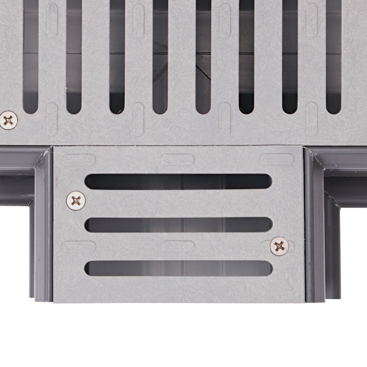 Closeup topdown view of the 90 degree angle of the tee section on the grate of the Spee-D® Channel Drain and Grate with Tee (NDS 2371)
