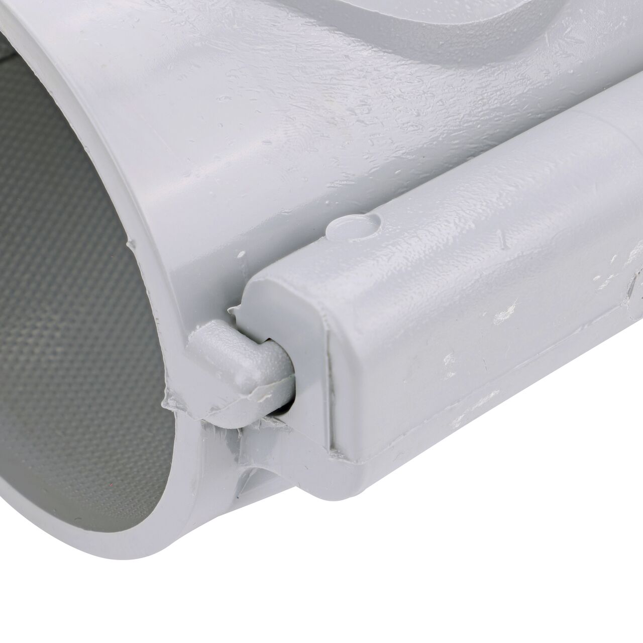 Closeup of the hinge closed on the NDS Clamp-It™ Rigid PVC Saddle with 1 in. FPT connection on top (NDS 443010) for 3 in. PVC pipe