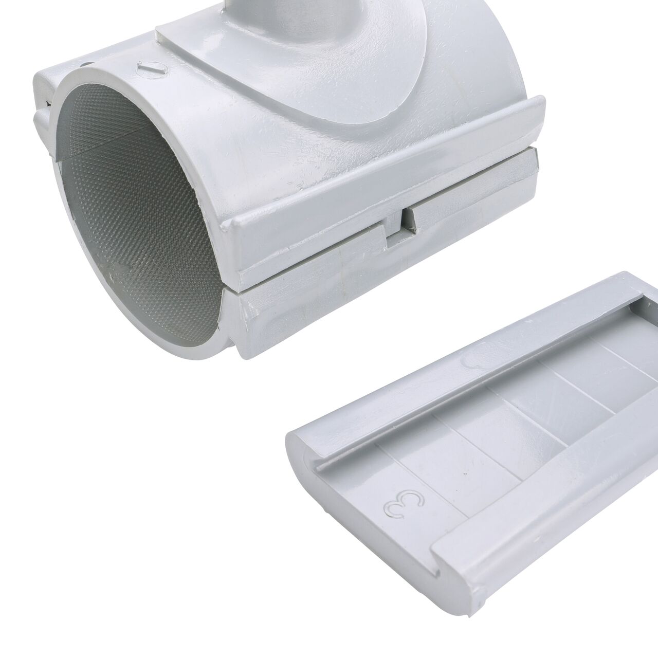 Closeup of the wedge latch uninstalled on the NDS Clamp-It™ Rigid PVC Saddle with 1 in. FPT connection on top (NDS 443010) for 3 in. PVC pipe