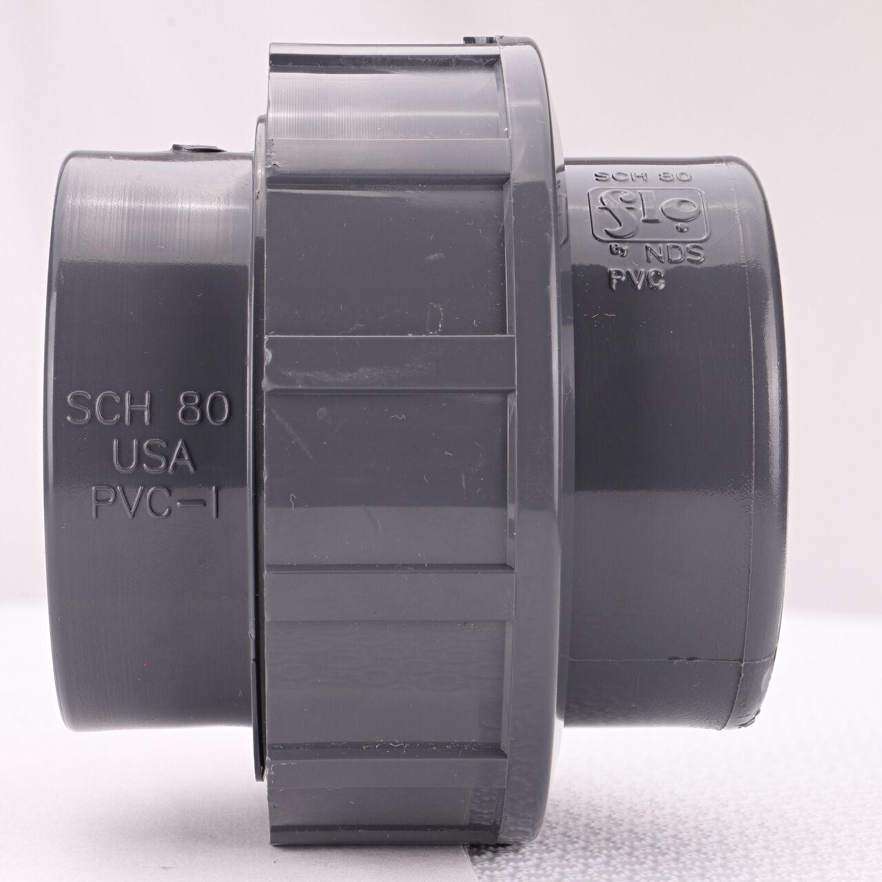 Side view of the NDS 2 in. PVC Union (NDS U-2000-S) shows both slip ends and a pull-apart feature to quickly disconnect from pipes