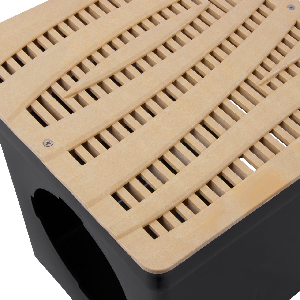 Closeup shot of NDS 12 in. Square Catch Basin Drain Grate, Decorative Wave Design, Sand Plastic (NDS 1224S) and how it fits securely within a 12 in. Square Catch Basin Drain with 2 Openings (NDS 1200*); retail