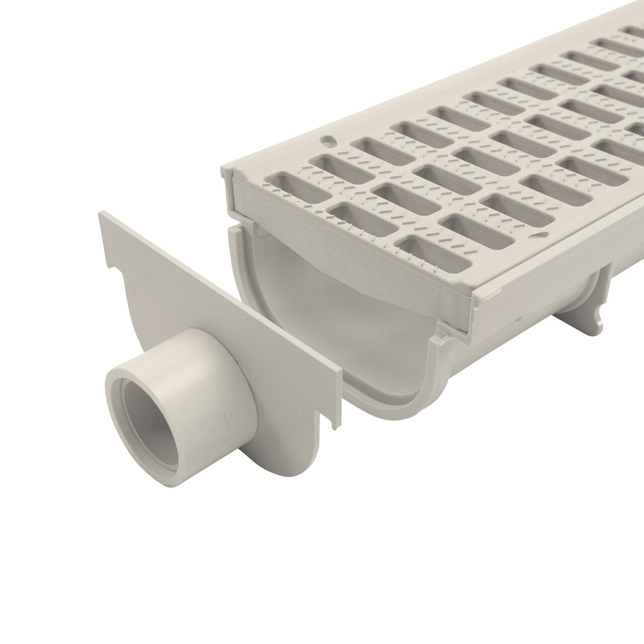 NDS 5 in. Pro Series Channel Drain, End Cap/End Outlet (NDS 821) just before being installed on the Shallow Profile Channel Drain (NDS 800) and Grate (NDS 814)
