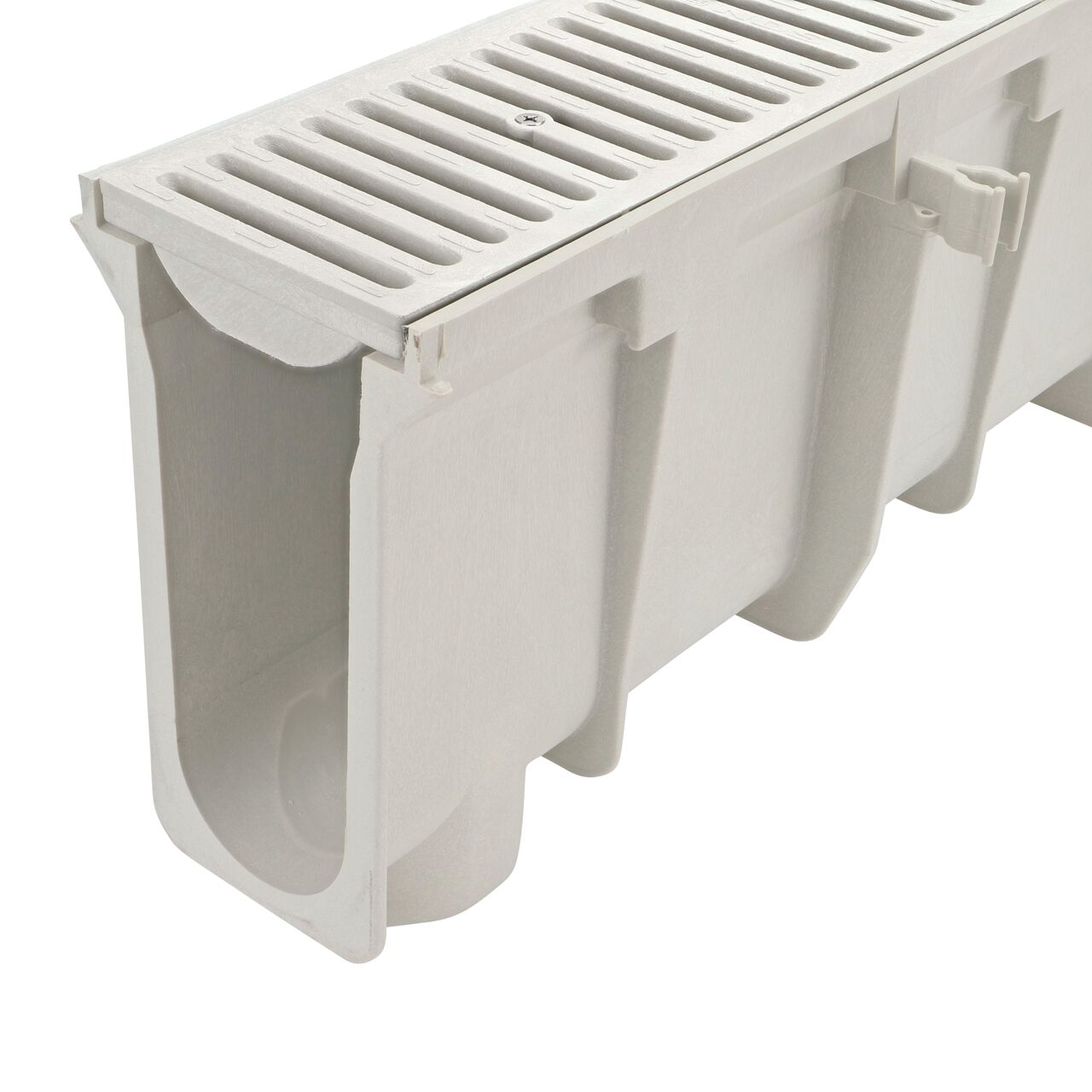 Closeup tongue (male) side of the NDS 10.38 in. to 10.71 in. Deep Dura Slope Channel Drain (NDS DS-110) with the Standard Dura Slope Light Gray Grate installed (NDS 661LG)