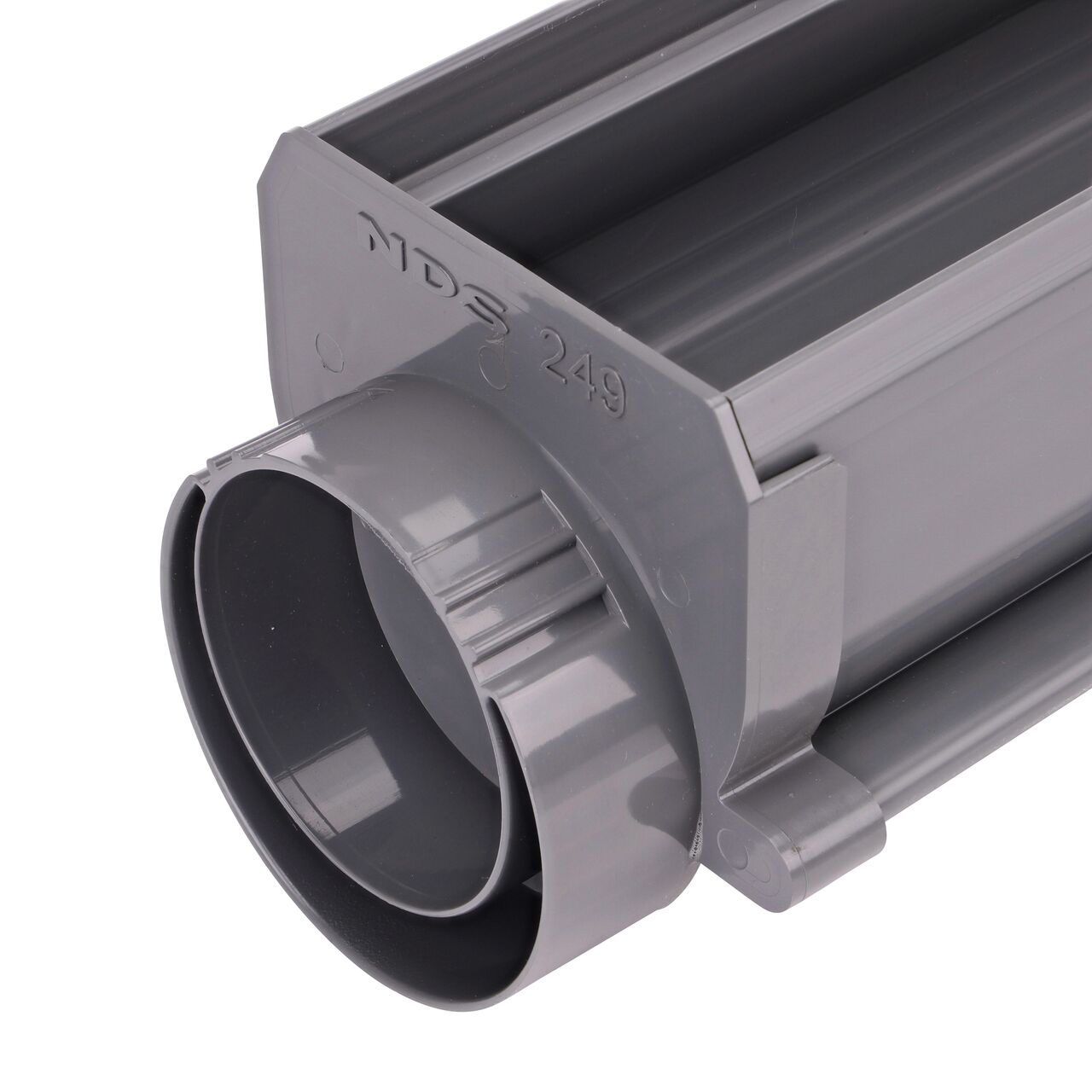 Closeup of the NDS Spee-D® Channel Drain Offset End Outlet (NDS 249) connected to a Spee-D® Channel Drain (NDS 400, NDS 400-10)