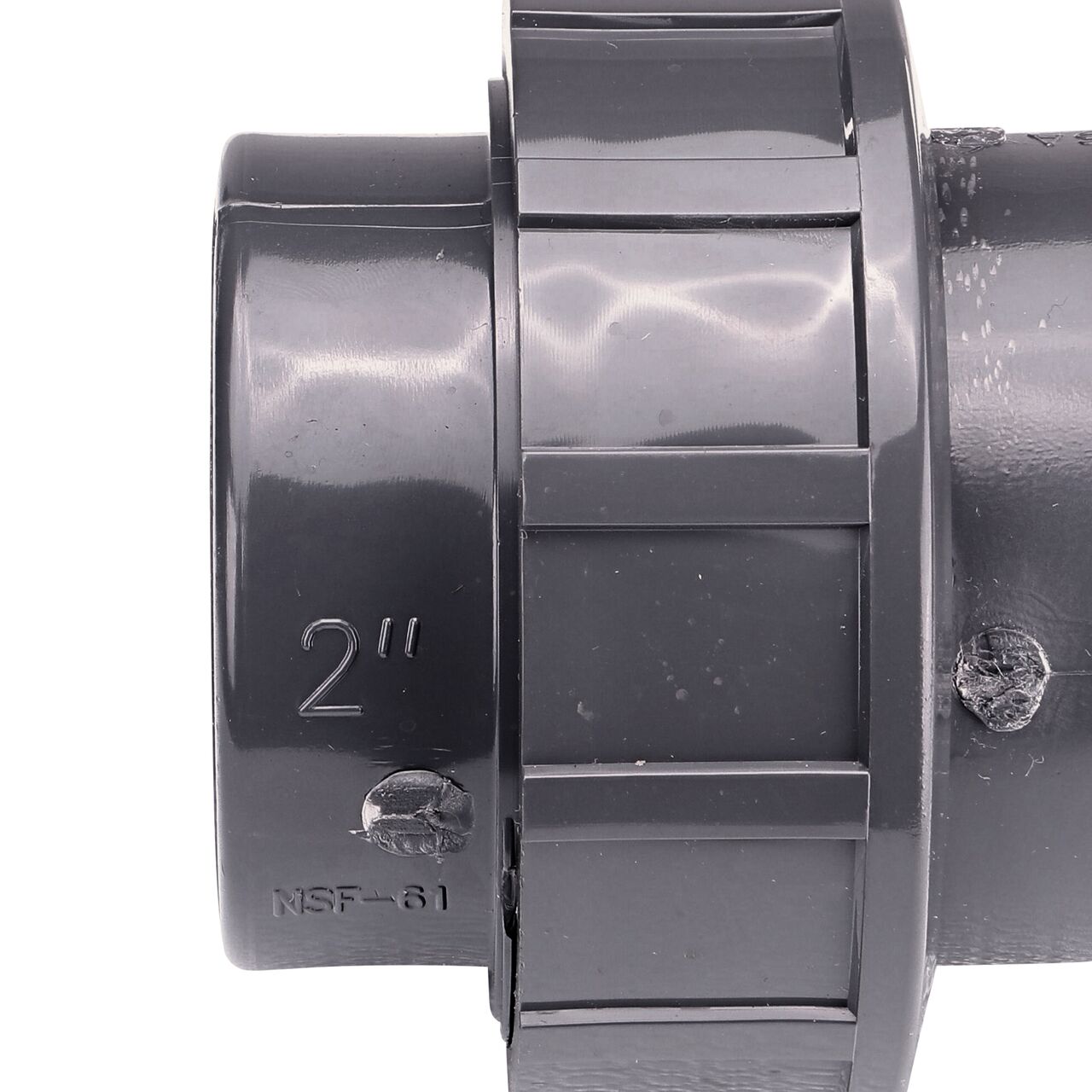Closeup view of the NDS 2 in. PVC FPT Union shows each end is labeled that it connects to 2 in. Schedule 80 pipe for residential, commercial, and industrial applications (NDS U-2000-T)