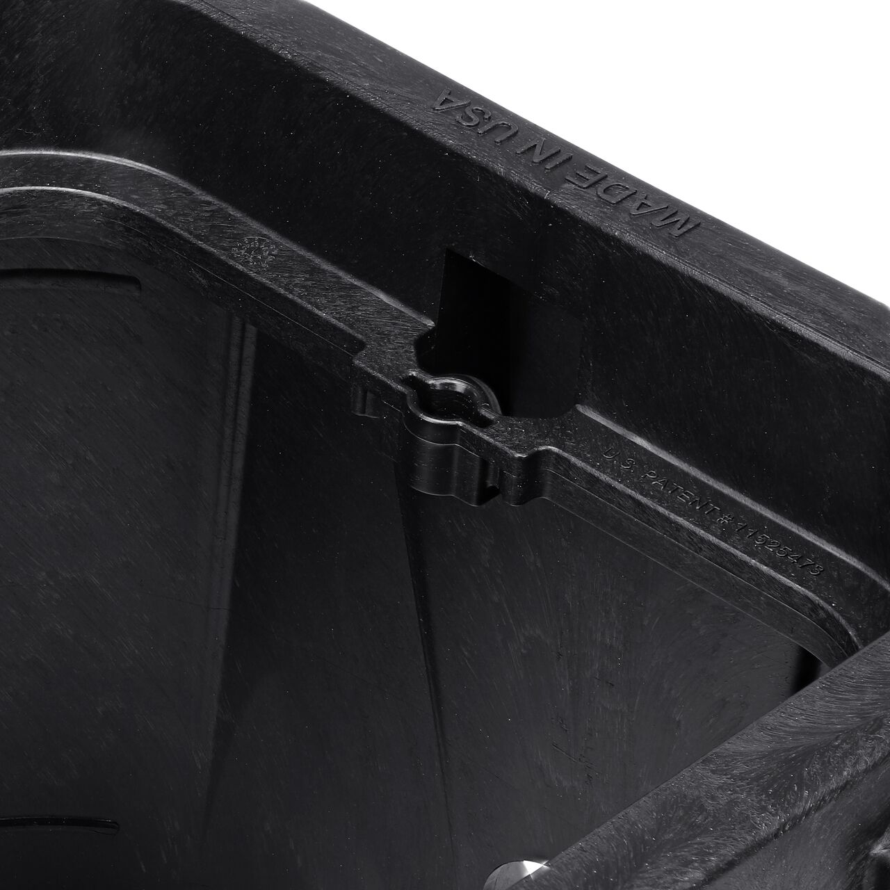 Closeup view of the universal locking mechanism hole on the Black NDS 14 in. X 19 in. Rectangular Pro-Spec® Series Valve Box (NDS 313BCBWBLK) for securing valve lid or cover to the valve box