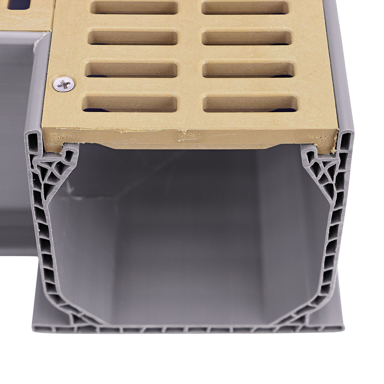 Closeup of the top of the opening showing the grate design of the NDS Sand Mini Channel™ Drain 90° Elbow and Grate (NDS 5383)