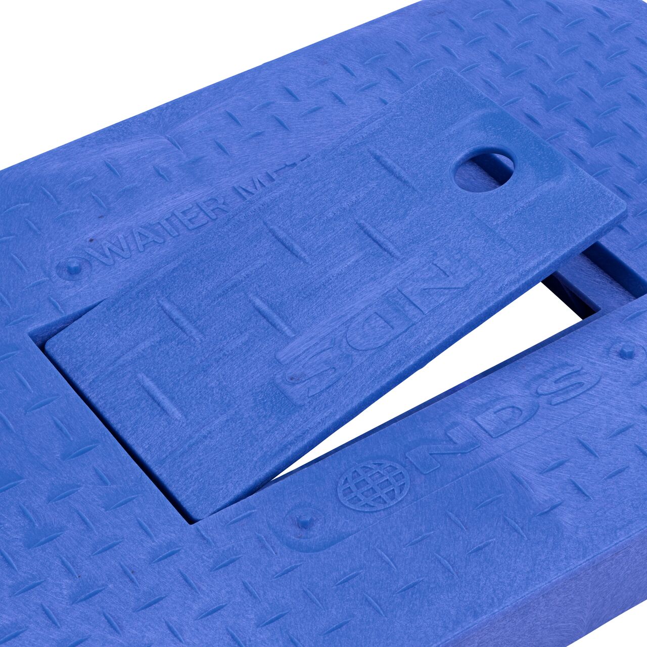 Close up view of the hinged side of the Plastic reader door on the Water Meter Blue Drop-In 14 in. X 19 in. Rectangular Standard Series Meter Cover which allows for easy meter reading (NDS D1200-DIBLRDL)