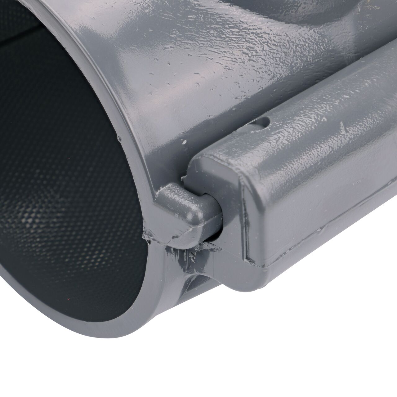 Closeup of the hinge closed on the NDS Clamp-It™ Rigid PVC Saddle with 1 in. slip connection on top (NDS 453010) for 3 in. PVC pipe