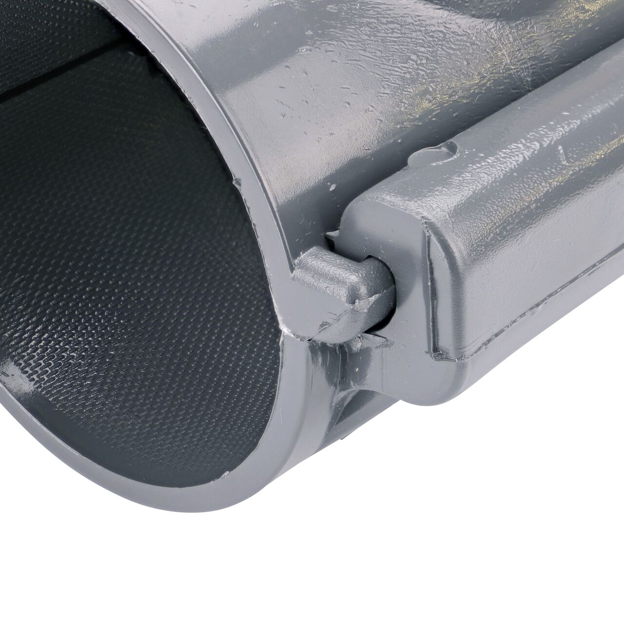 Closeup of the hinge closed on the NDS Clamp-It™ Rigid PVC Saddle with 2 in. slip connection on top (NDS 453020) for 3 in. PVC pipe