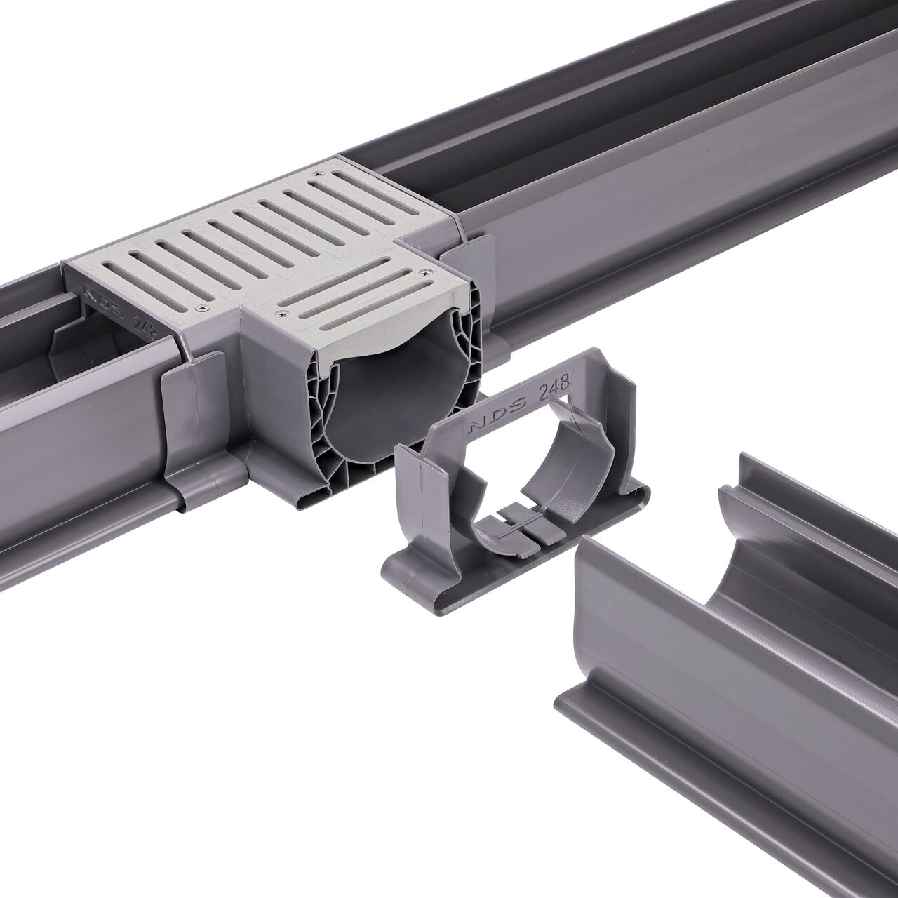 Fully installed NDS Gray Spee-D® Channel Drain Cross and Grate (NDS 2371) with couplers attached to all ends with channel drains connected