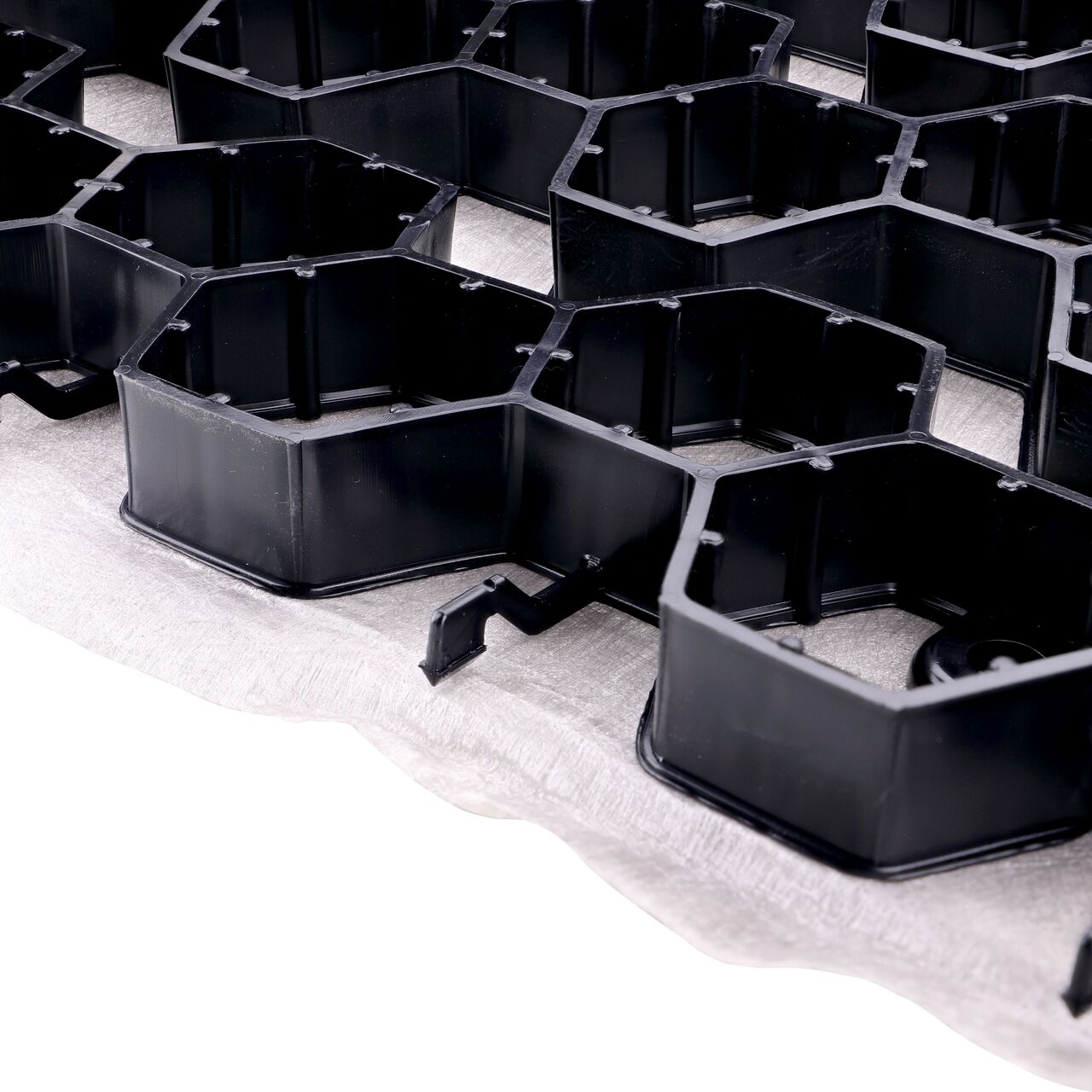 Closeup view of the end to end hook style locking mechanism on the Black NDS EZ Roll® Gravel Paver (NDS GP4X150)